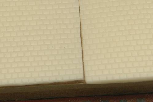 Detailfoto van het motief van giethars-replica's van plaatjes met stoeptegelmotief