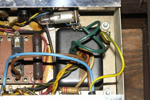 The transformer on board the Ampeg R12A amplifier and some of its surrounding parts