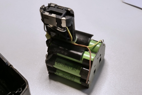 A group of cilindrical battery cells after opening up a Hitachi BCL-1430 battery